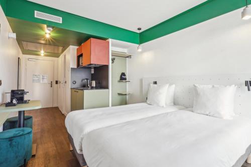 Estudio Confort - Camas individuales del hotel and hotel All Suites Paris 13 Porte d'Italie. Foto 3