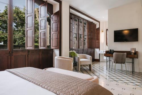 Habitación Deluxe del hotel MASANET Emblematic Adults Only. Foto 1