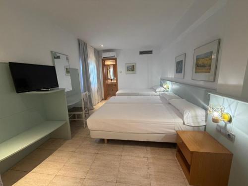 Habitación Triple del hotel Fleming Center by Punta25