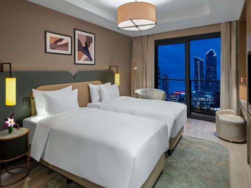 Superior One - Bedroom Apartment with Twin Beds del hotel Mövenpick Living Istanbul Saklivadi. Foto 3