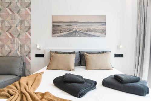 Habitación Triple Clásica del hotel La Vega de Ciudad Jardín Suites