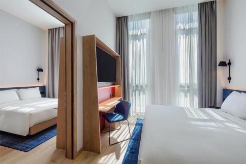 Habitación Familiar - Cama grande del hotel Hampton By Hilton Venice Isola Nuova. Foto 2