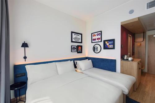 Habitación con sofá cama - 1 cama grande del hotel Hampton By Hilton Venice Isola Nuova. Foto 3