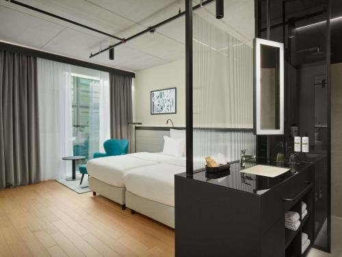 Habitación estándar con dos camas individuales del hotel Pullman Zagreb. Foto 2