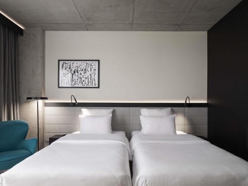 Habitación estándar con dos camas individuales del hotel Pullman Zagreb. Foto 5