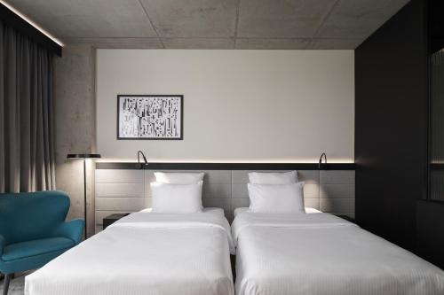 Habitación estándar con dos camas individuales del hotel Pullman Zagreb. Foto 10