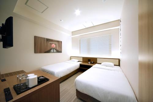 Habitación Doble Superior - 2 camas del hotel Travelodge Kyoto Shijo Kawaramachi. Foto 2