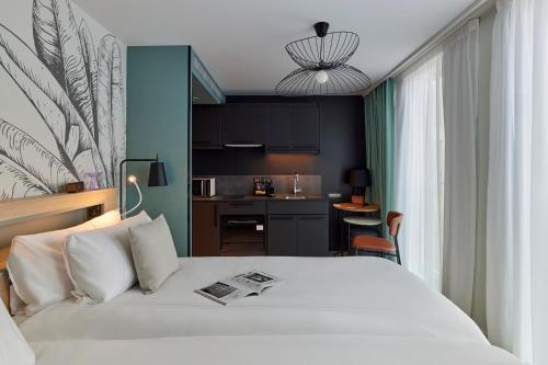 Estudio con 2 camas individuales del hotel Adagio London City East. Foto 6