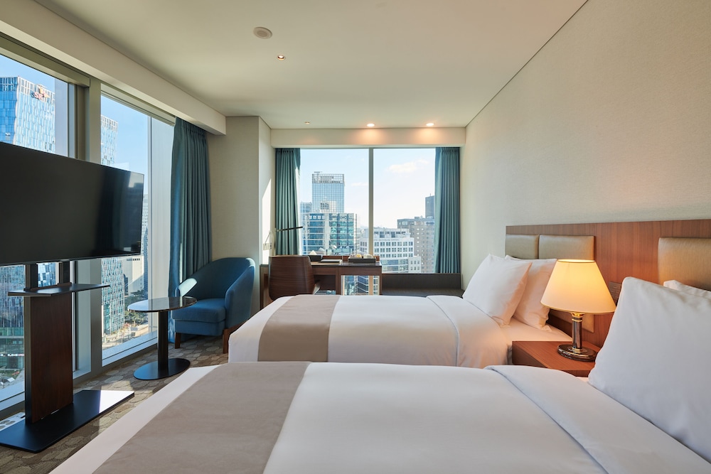 Habitación superior con 2 camas individuales del hotel Stanford Myeongdong. Foto 1