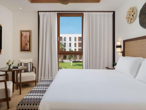 Habitación Doble Deluxe con vistas al jardín del hotel Gran Taoro. Foto 1
