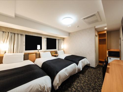 Habitación Triple Estándar - No fumadores del hotel APA Hotel and Resort Osaka Namba Ekimae Tower. Foto 3