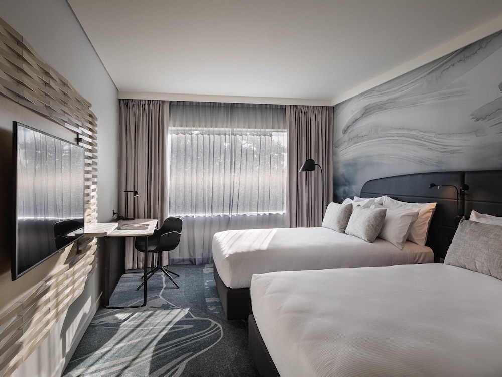 Habitación ejecutiva con 2 camas dobles del hotel Novotel Tainui Hamilton