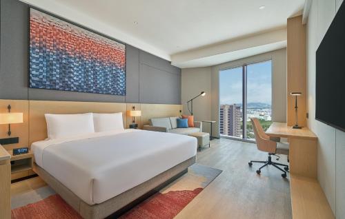 1 Cama King, Sofá Cama del hotel Hyatt Place Yantai Development Zone. Foto 1