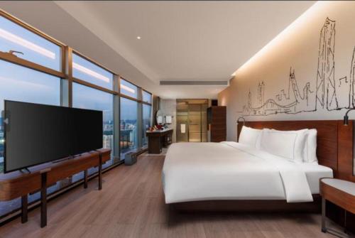 Executive Deluxe con cama king del hotel UrCove By Hyatt ShenZhen Futian Port