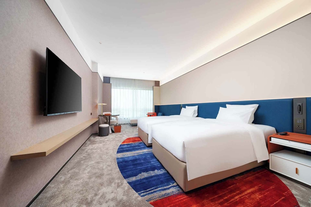 Habitación superior, 2 camas individuales del hotel Novotel Nanjing Airport. Foto 1