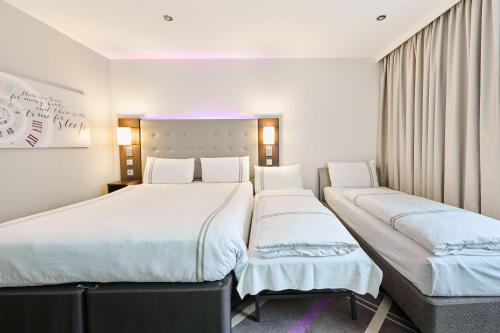 Habitación Cuádruple Estándar del hotel Premier Inn München City Zentrum. Foto 8