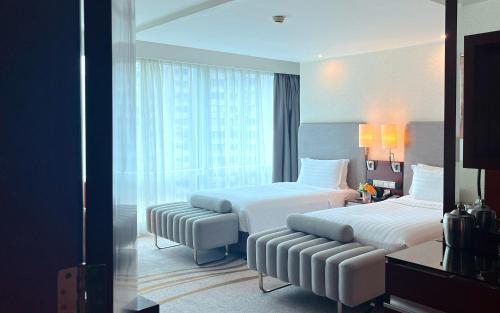 Habitación Doble Executive Deluxe - 2 camas del hotel Pullman Shanghai Central. Foto 3