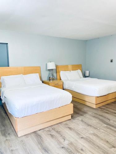Habitación Doble - 2 camas dobles del hotel Tides Motor Inn. Foto 6