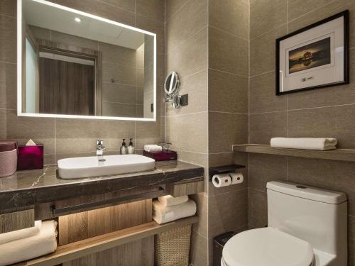 Habitación Deluxe con 2 camas individuales del hotel Mercure Xi\'an Daming Palace. Foto 1