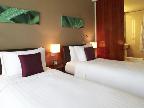 Habitación Doble Estándar - 2 camas del hotel Novotel Citygate Hong Kong. Foto 1