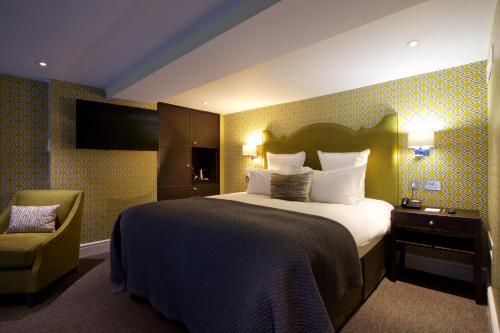 Suite Deluxe con cama extragrande del hotel 54 Queens Gate. Foto 8