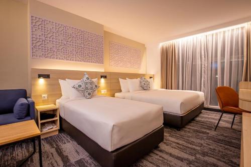 Alojamiento Tiga Familiar del hotel Santa Grand Signature Kuala Lumpur. Foto 2