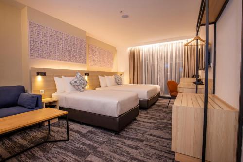 Alojamiento Tiga Familiar del hotel Santa Grand Signature Kuala Lumpur. Foto 3
