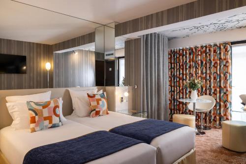 Habitación Doble Deluxe con balcón del hotel 7 Eiffel By Malone