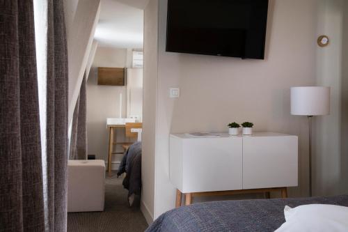 Habitación Triple del hotel D'espagne. Foto 1