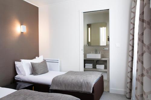 Habitación Triple del hotel D'espagne. Foto 4