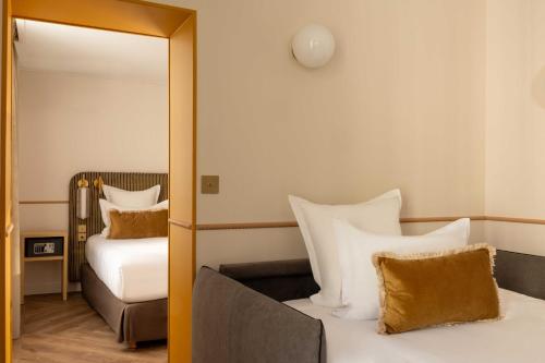 Habitación Triple Deluxe del hotel D'espagne. Foto 10