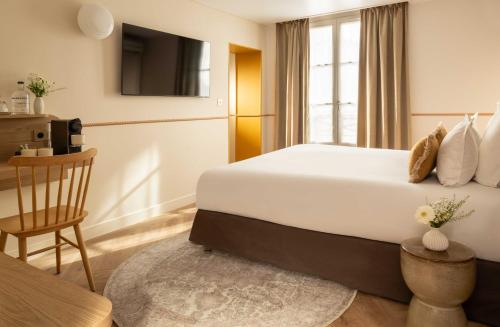 Habitación Triple Deluxe del hotel D'espagne. Foto 11
