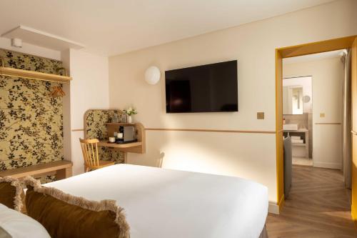 Habitación Triple Deluxe del hotel D'espagne. Foto 12