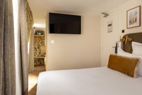 Habitación Triple Deluxe del hotel D'espagne. Foto 16