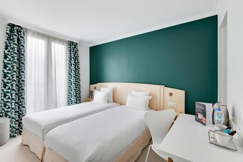 Habitación Twin Premium del hotel Elysées Opéra. Foto 8