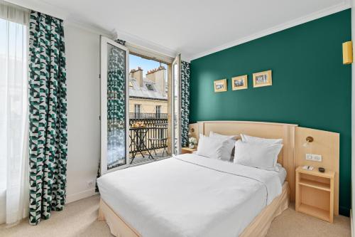 Habitación Doble Premium con balcón del hotel Elysées Opéra. Foto 2