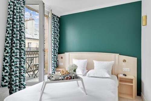 Habitación Doble Premium con balcón del hotel Elysées Opéra. Foto 9