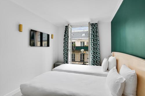 Habitación Doble Premium con balcón del hotel Elysées Opéra. Foto 18