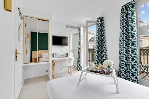 Habitación Doble Premium con balcón del hotel Elysées Opéra. Foto 21