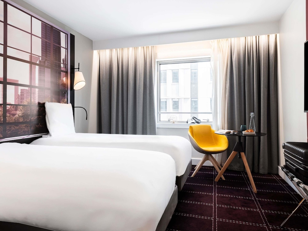 Habitación Clásica con camas individuales del hotel Mercure Paris La Defense Grande Arche. Foto 2
