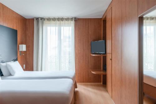 Habitación Doble Estándar - 2 camas del hotel Best Western Ronceray Opera. Foto 1
