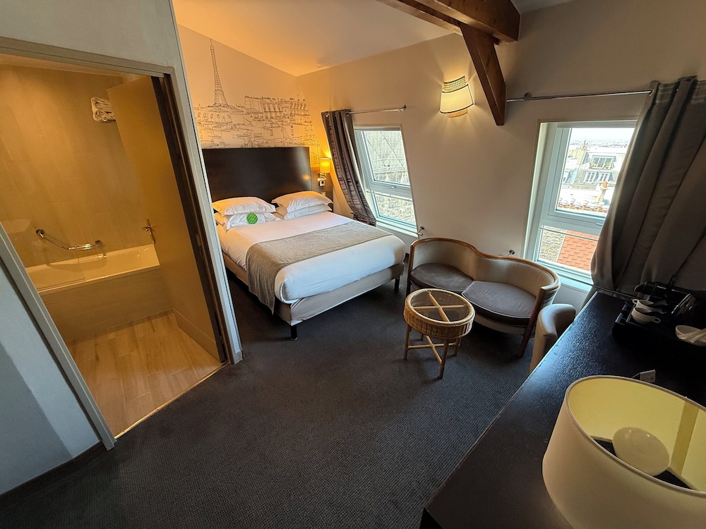 Habitación estándar, 1 cama de matrimonio grande del hotel Holiday Inn Paris Montmartre. Foto 7