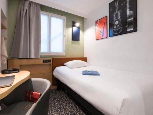 Habitación Estándar con cama individual del hotel IBIS PARIS GARE DU NORD TGV. Foto 1