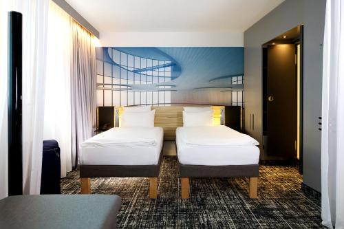 Suite Estándar con sofá cama - 2 camas individuales del hotel Novotel Suites Berlin City Potsdamer Platz. Foto 7