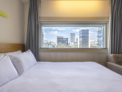 Habitación Doble en planta Executive - No fumadores del hotel Gracery Ginza. Foto 6