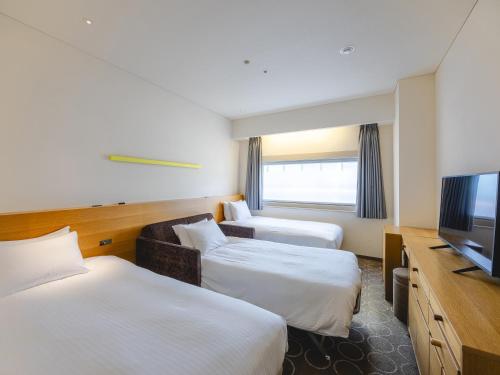 Habitación Doble con 2 camas y 1 cama supletoria - Planta Executive - No fumadores del hotel Gracery Ginza. Foto 5