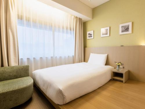 Habitación individual estándar con suelo de madera - No fumadores (Servicios ReFa) del hotel Gracery Ginza. Foto 2