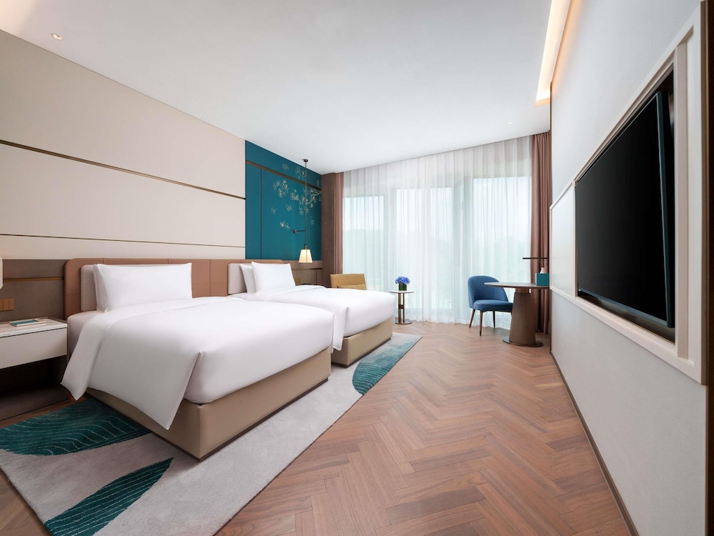 Habitación Deluxe Ejecutiva, Acceso al Salón, 2 camas dobles del hotel Grand Mercure Hangzhou Qingshan Lake