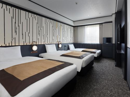 Habitación Triple Superior del hotel Mitsui Garden Shiodome Italia-gai. Foto 1