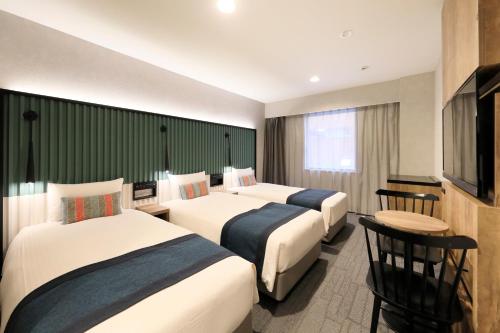 Habitación Triple Deluxe de 21 m² - No fumadores del hotel The Knot Tokyo Shinjuku. Foto 8